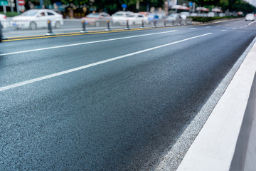 empty asphalt road through modern city in China.