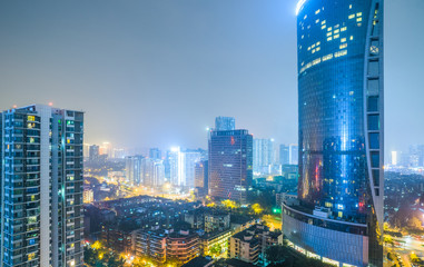 illuminated modern buildings at night in China.