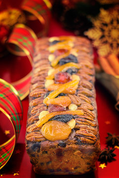 Traditional Christmas fruit cake with festive decorations and Xm