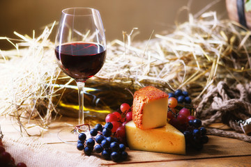 Glass of wine, grape and chesse 
