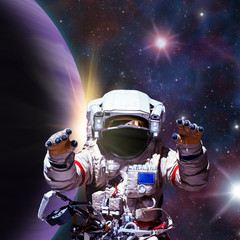 Obraz na płótnie Canvas Fantasy scene of an Astronaut near an alien planet. Computer art & photo