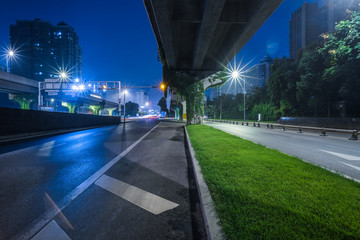 empty asphalt road through modern city in China.