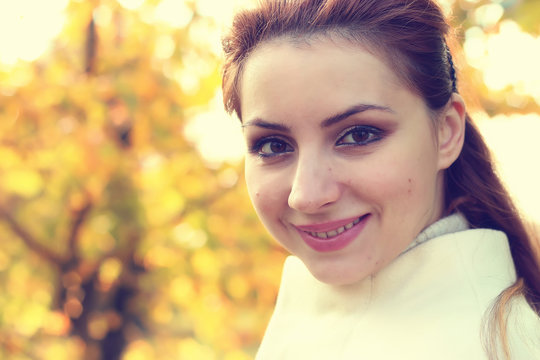 girl in a park walk autumn alone