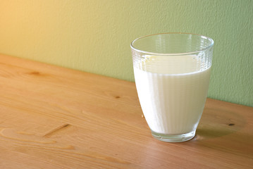 Fresh Milk in glass on the wood table for Morning