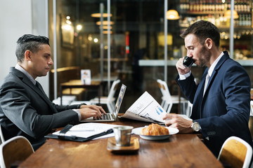 Businessmen Cafe Working Newspaper Concept