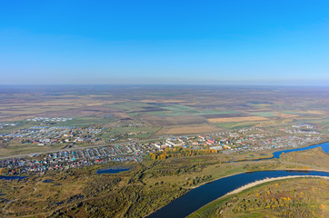 Aerial view onto Esaulovo village and Tura river during the autumn. Tyumen region