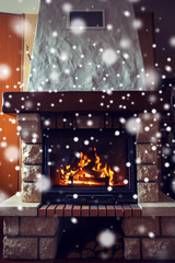 close up of burning fireplace with snow