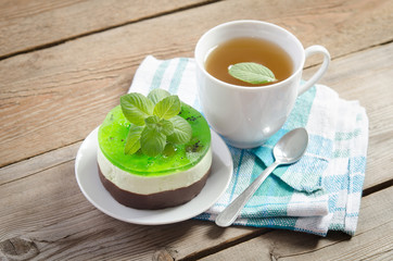 herbal tea with cake on wooden background. horizontal position
