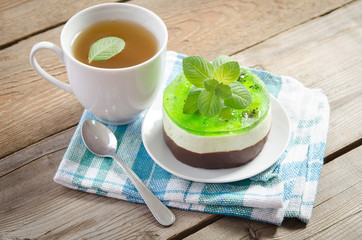 herbal tea with cake on wooden background. horizontal position