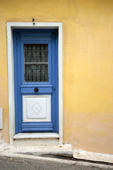 blue door n yellow wall