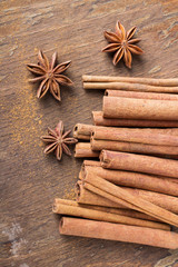 cinnamon sticks and  star anise on wooden background