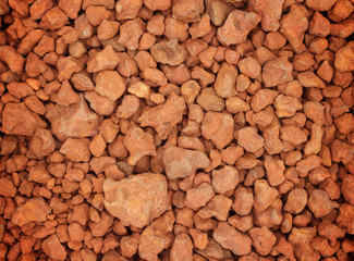 Closeup of red stone pebbles
