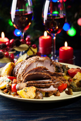 Obraz na płótnie Canvas Juicy roast pork on the holiday table
