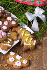 Colorful Christmas gingerbread cookies on wooden background