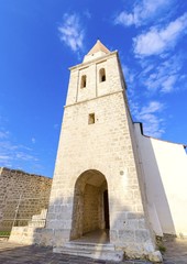 Pyramidal tower of the Church of our Lady of Health, romanesque cathedral formely named St Michael the archangel, basilica at the Square of The Glagolitic housed monasteries on Krk island, in Croatia.