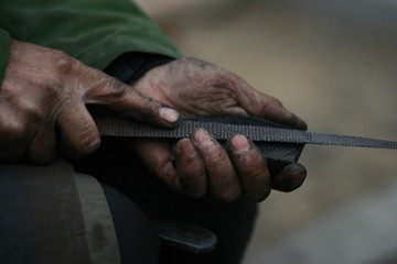 The hands of a shoe repairer 