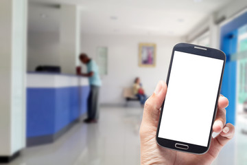 Hand holding blank screen mobile phone with Blurred  inside car