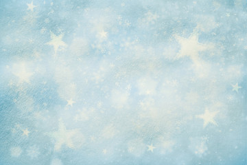 Artistic snow texture background with illustrated soft blue color snowflakes and star shapes background. Dreamy Christmas and New Year Holidays snow copy space background.