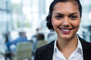 Fototapeta premium Smiling businesswoman in office