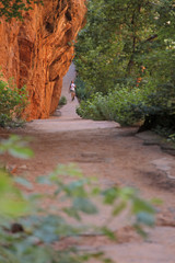 path rock wall trees n hikers