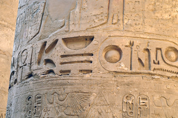 Ancient Egypt. The columns are decorated with carved hieroglyphs. Karnak Temple. Luxor. Thebes.
