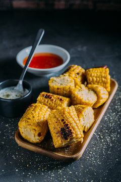 Grilled corn with spicy sauce