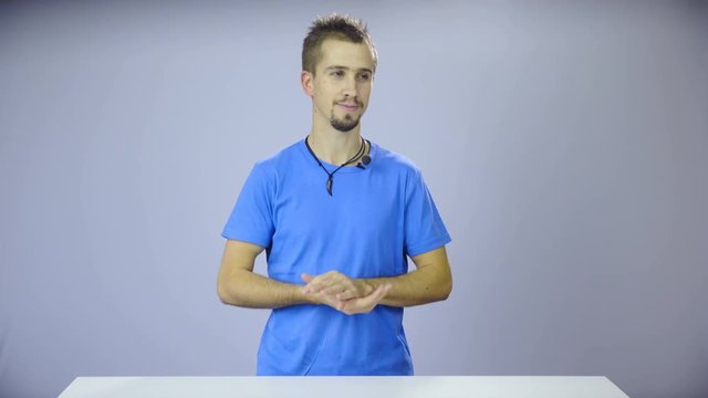 Man in white TV studio talking to staff 4K
