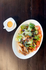 Breaded chicken with salad ,soft focus
