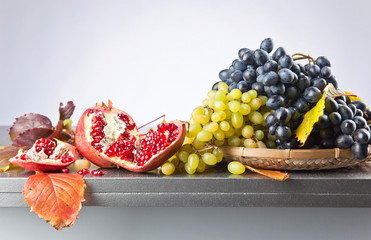 Blue and white grapes with pomegranate