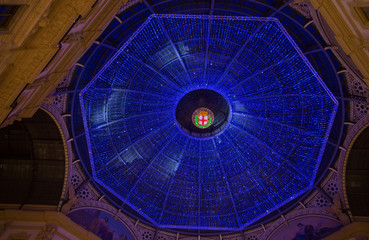 MILAN, ITALY - Dicember 24, 2015 -  Galleria Vittorio Emanuele II in Milan on Dicember 24 2015. Glass skylight dome at arcade Galleria Vittorio Emanuele II in Milan, Italy.
