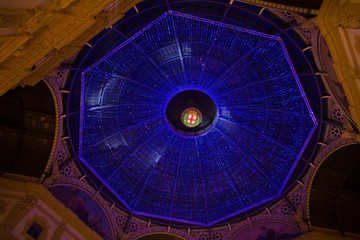 MILAN, ITALY - Dicember 24, 2015 -  Galleria Vittorio Emanuele II in Milan on Dicember 24 2015. Glass skylight dome at arcade Galleria Vittorio Emanuele II in Milan, Italy.
