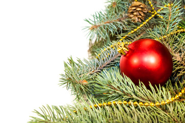 Christmas tree branches with cones, gifts and toys on a white ba