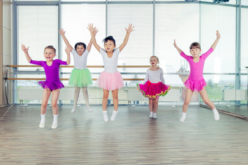 Fototapeta premium happy children dancing on in hall, healthy life, kid's togethern