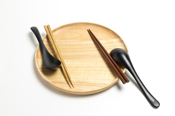 Wooden plate or tray with chopsticks and spoon isolated on white background