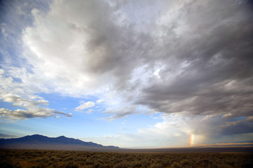 Naklejka na ściany i meble clouds desert n rainbow