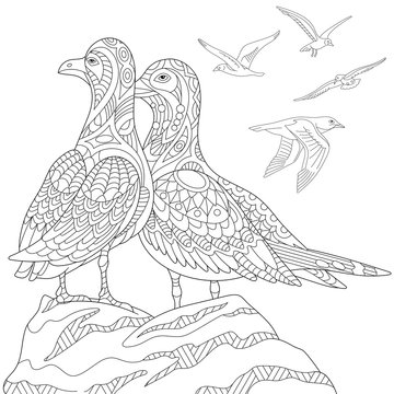 Stylized seagulls, flock of marine birds. Freehand sketch for adult anti stress coloring book page with doodle and zentangle elements.