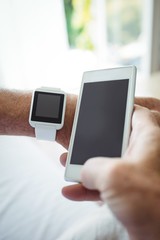 Senior man using mobile phone