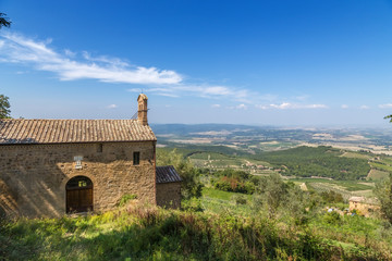 Fototapeta na wymiar Montalcino, Italy. The picturesque landscape with church