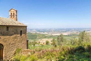 Fototapeta na wymiar Montalcino, Italy. The picturesque landscape with ancient church