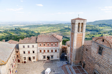 Montepulciano, Italy. Large Square in the center - Contucci Palace, on the right - the bell tower (XV c.) and the Cathedral of the Assumption the Virgin Mary, 1592 - 1630