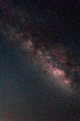 Milky Way galaxy, Long exposure photograph, with grain.Image contain certain grain or noise and soft focus.
