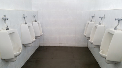 Urinals in public toilet. public restroom for men.