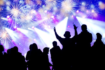 Fototapeta na wymiar New Year concept. Celebrating crowd and fireworks