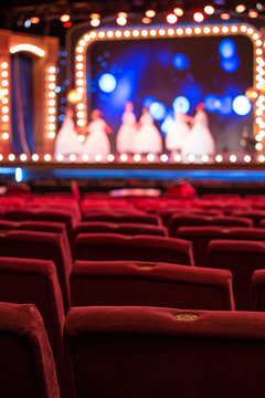 Performance Hall with Empty Red Chairs 