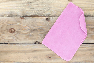 Fototapeta premium cloth on wooden background.