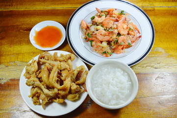 boiled rice eat with fried chicken and spicy shrimp salad