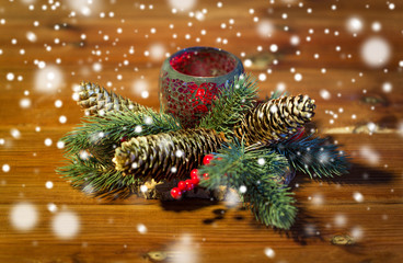 christmas fir branch decoration and candle lantern