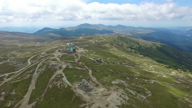Aerial flight over Babele chalet on Bucegi plateau, Romania