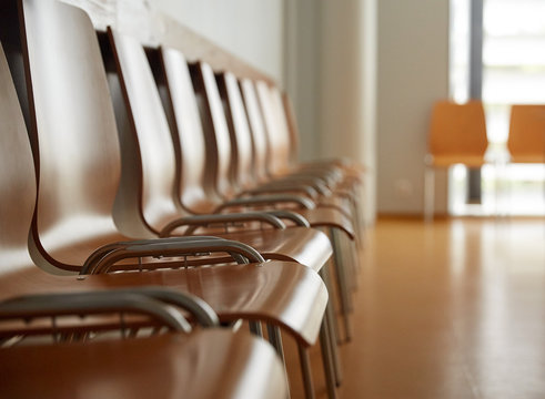 Wooden Chairs At Hospital Waiting Room