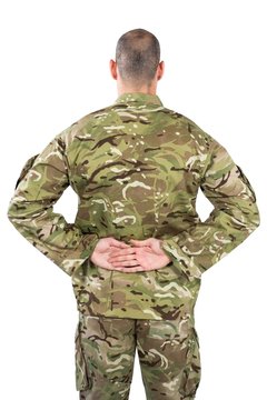 Rear View Od Soldier Standing With His Hands Behind Back